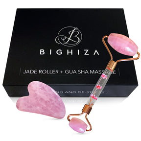 Pink face roller and gua sha beside a black BIGHIZA gift box